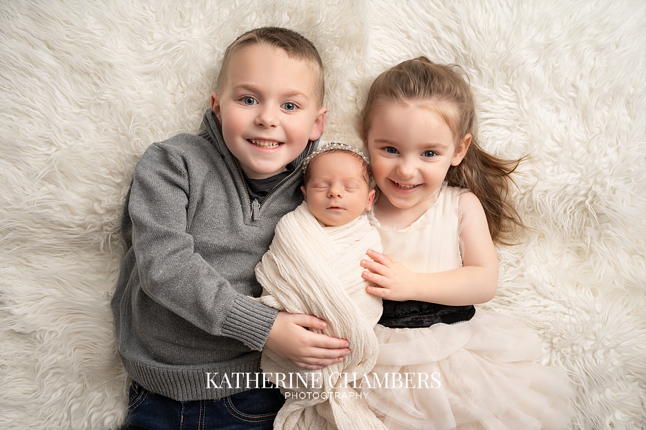 Siblings with Newborn Baby