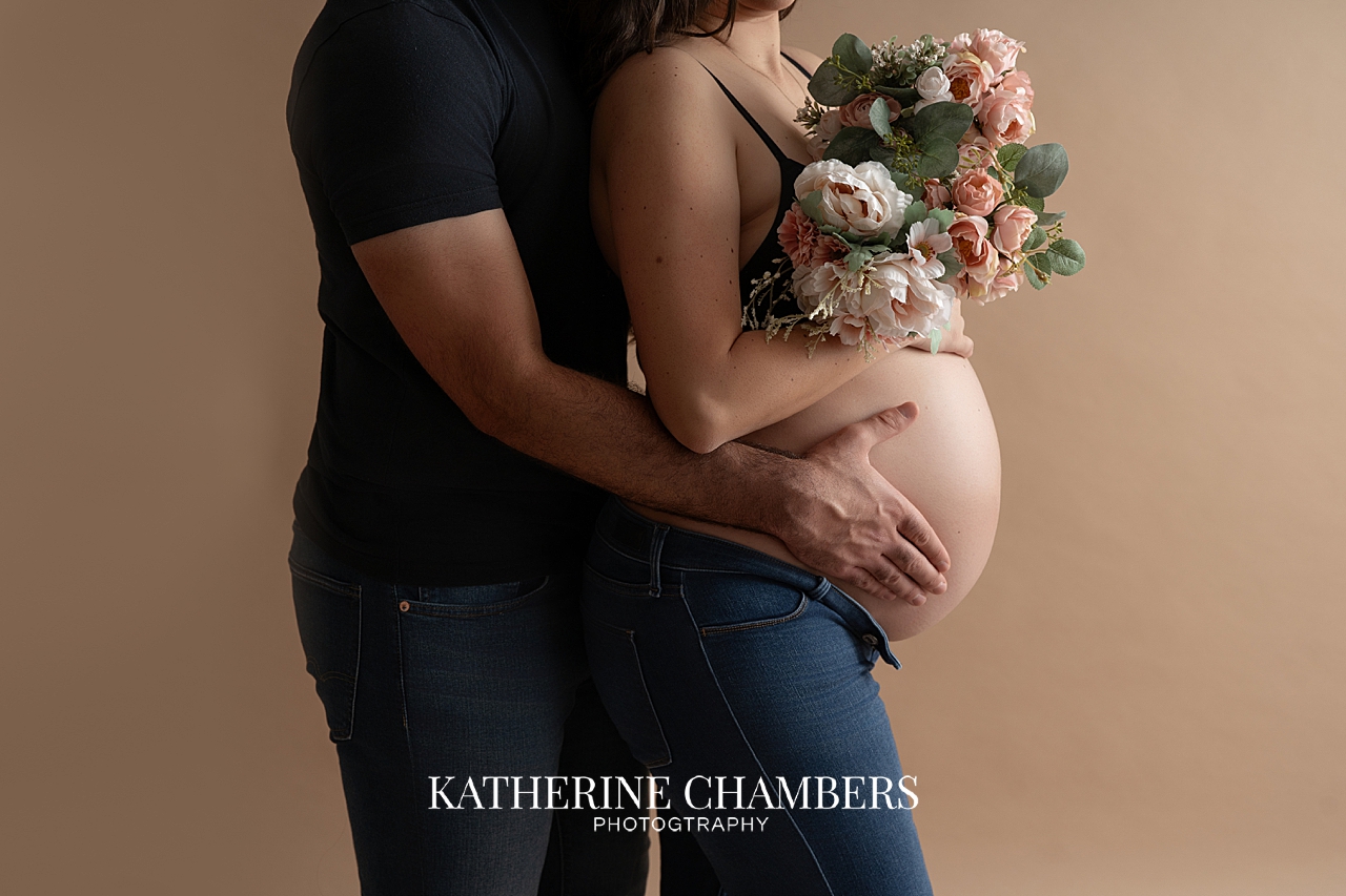 Close-up maternity portrait highlighting baby bump