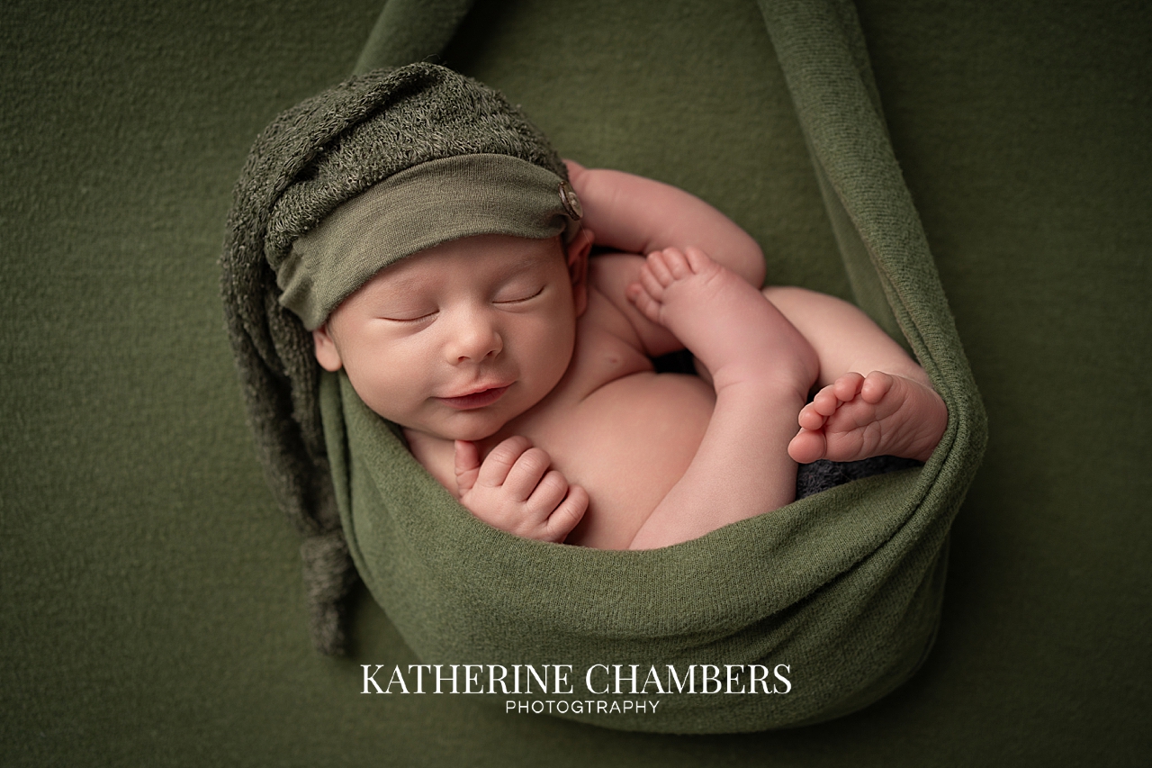 Newborn in sling