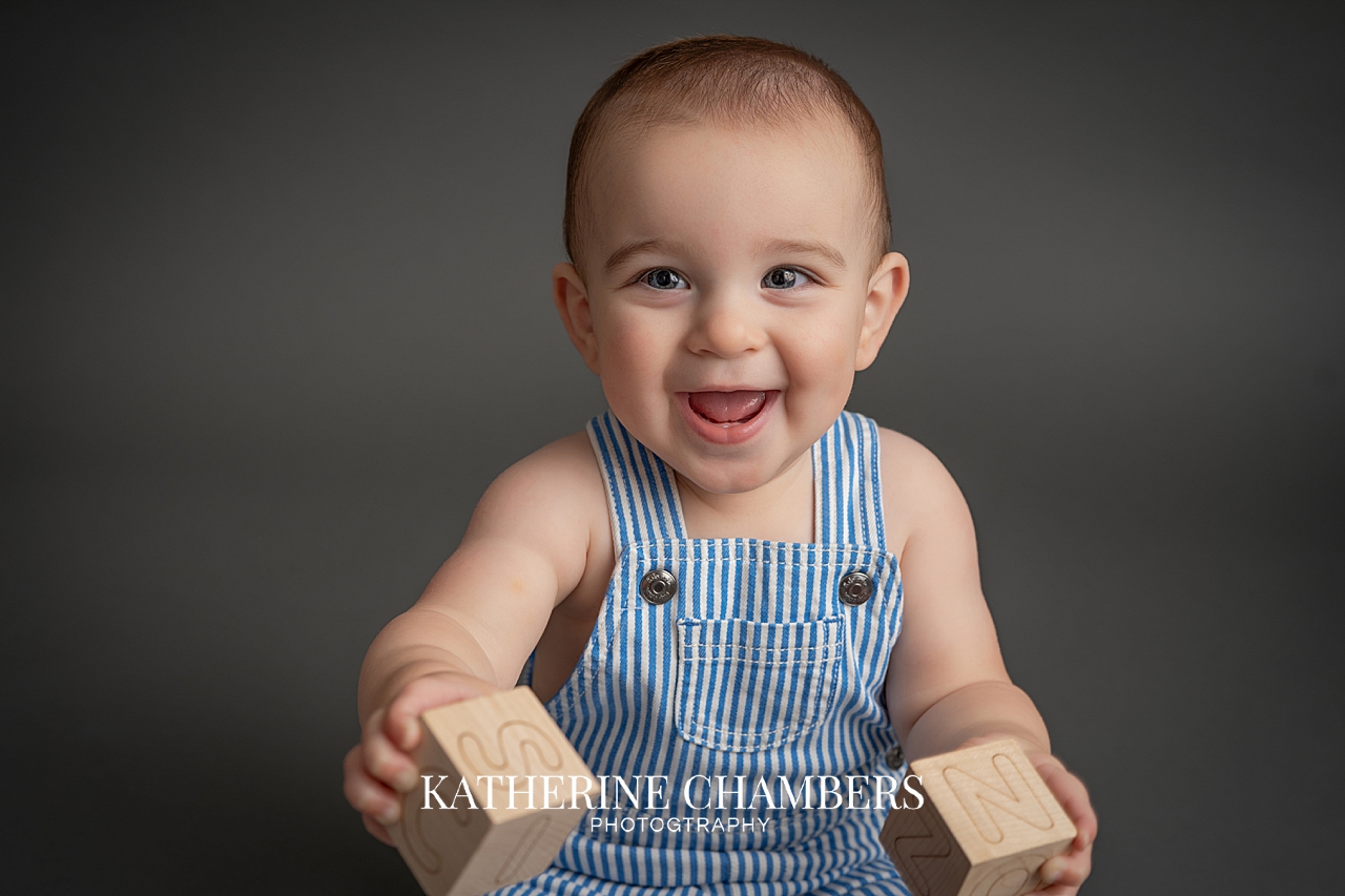 Close-up portrait of Elijah showing his beautiful blue eyes during his Cleveland cake smash session