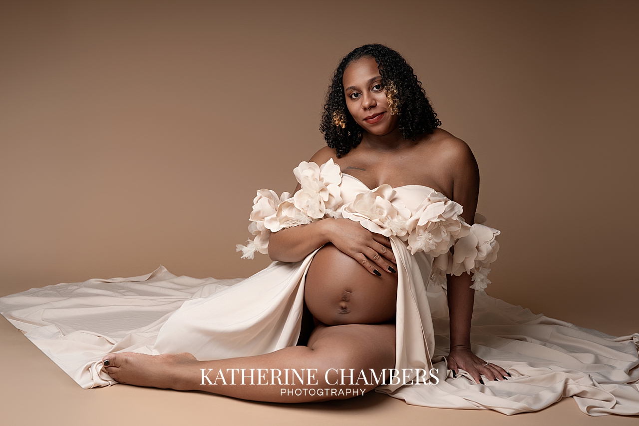 Seated maternity pose in studio Cleveland Ohio elegant pregnancy portrait
