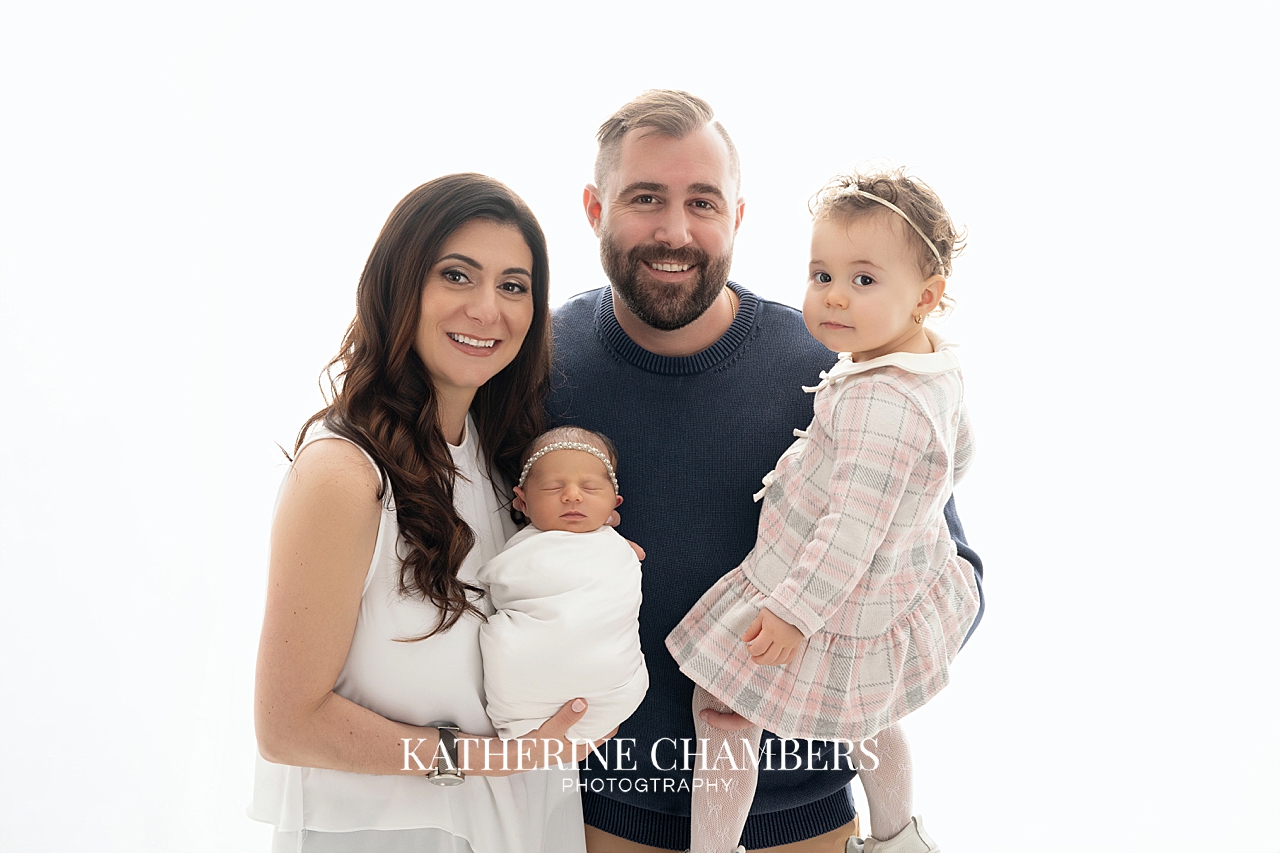 Family portrait with newborn baby girl in Avon photography studio