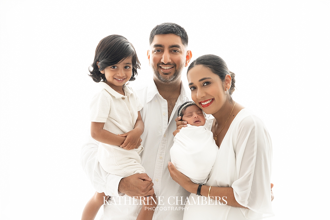 Cleveland newborn photographer capturing a family with their new baby girl.
