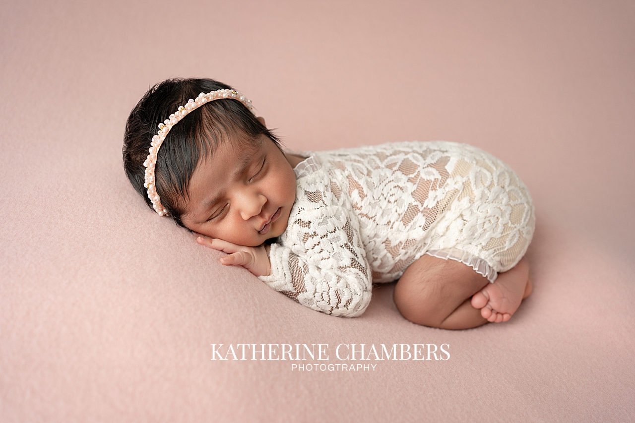 Baby Asha newborn portrait with dark hair in Cleveland studio.