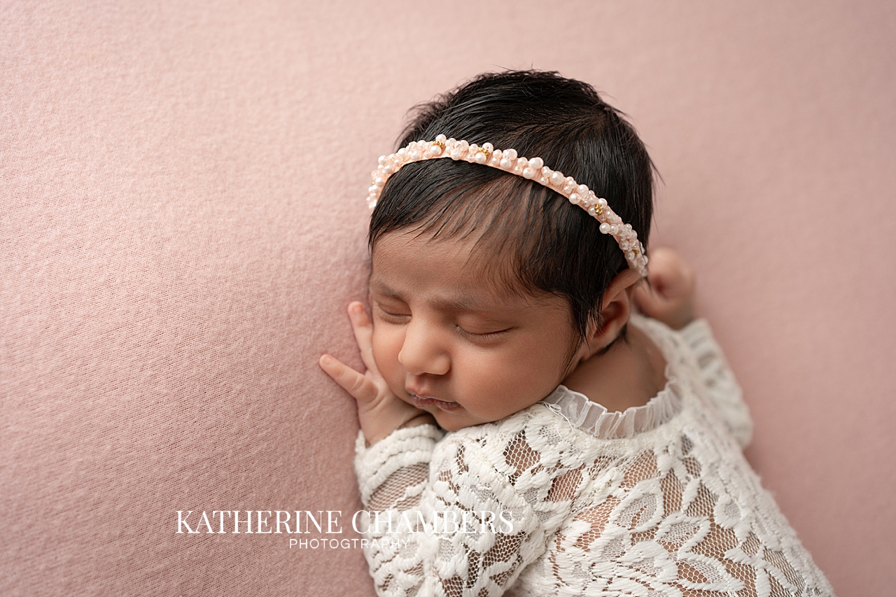 Newborn baby girl with pink headband