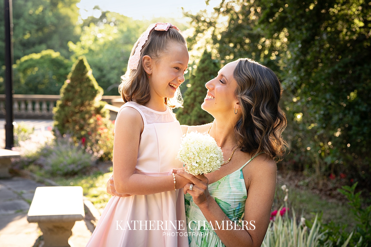 Audrey and her mom smiling at each other.