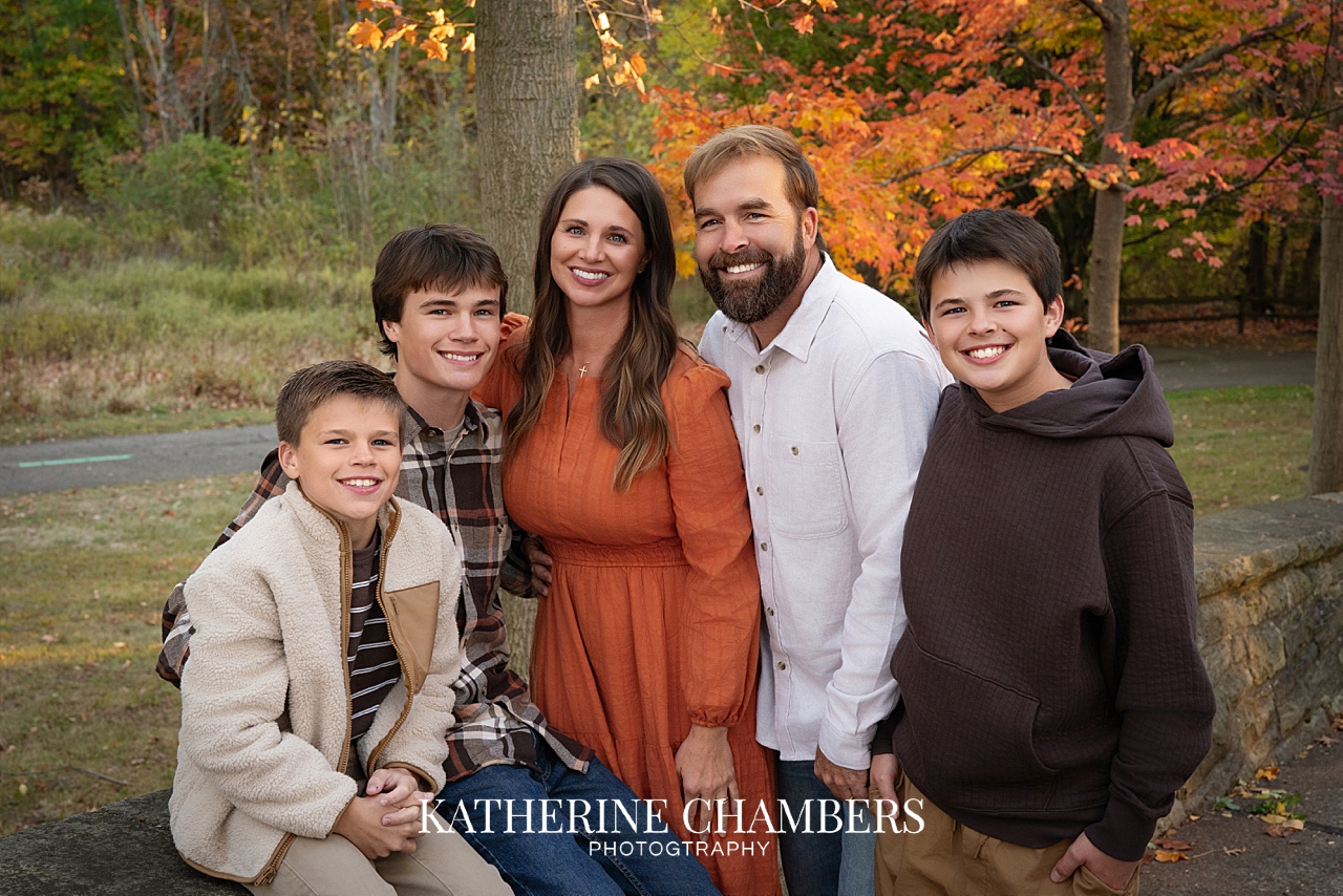 Cleveland family photography in a meadow with colorful autumn leaves
