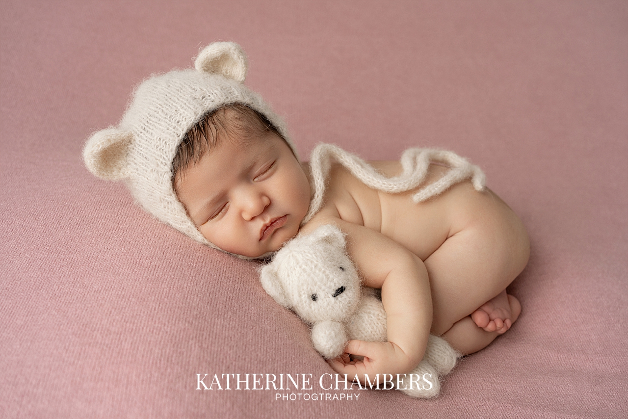 Newborn Lily in teddy bear hat